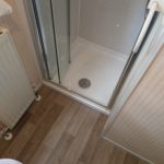 this photo shows the new shower tray fitted