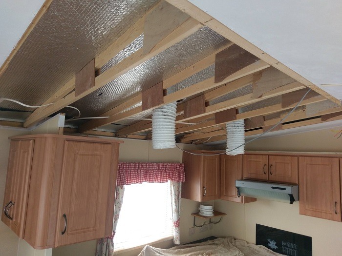 A ceiling board repair in a static caravan